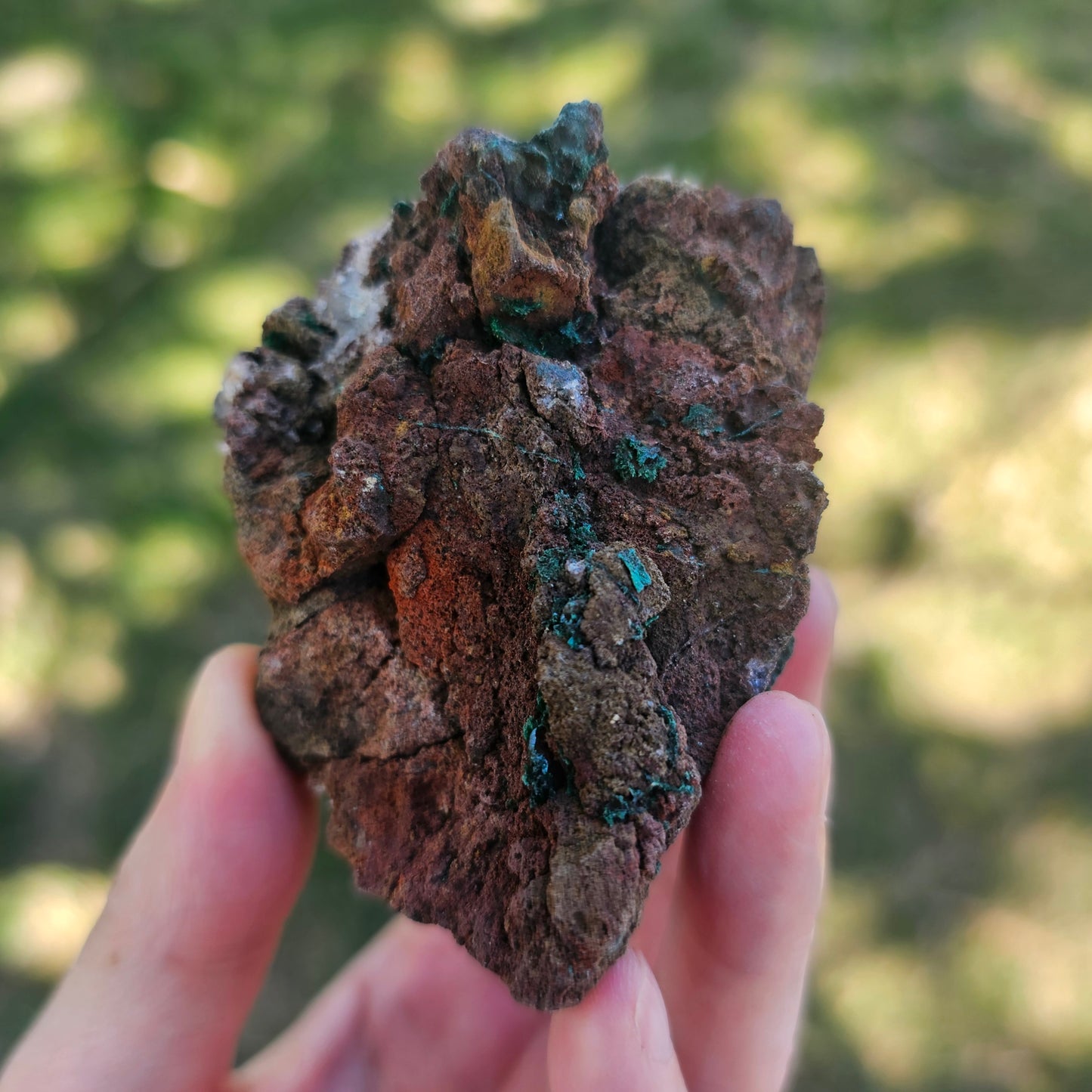A-grade forest green Malachite balls clustered on a natural quartz-feldspar matrix from Mindigi Mine, Congo.