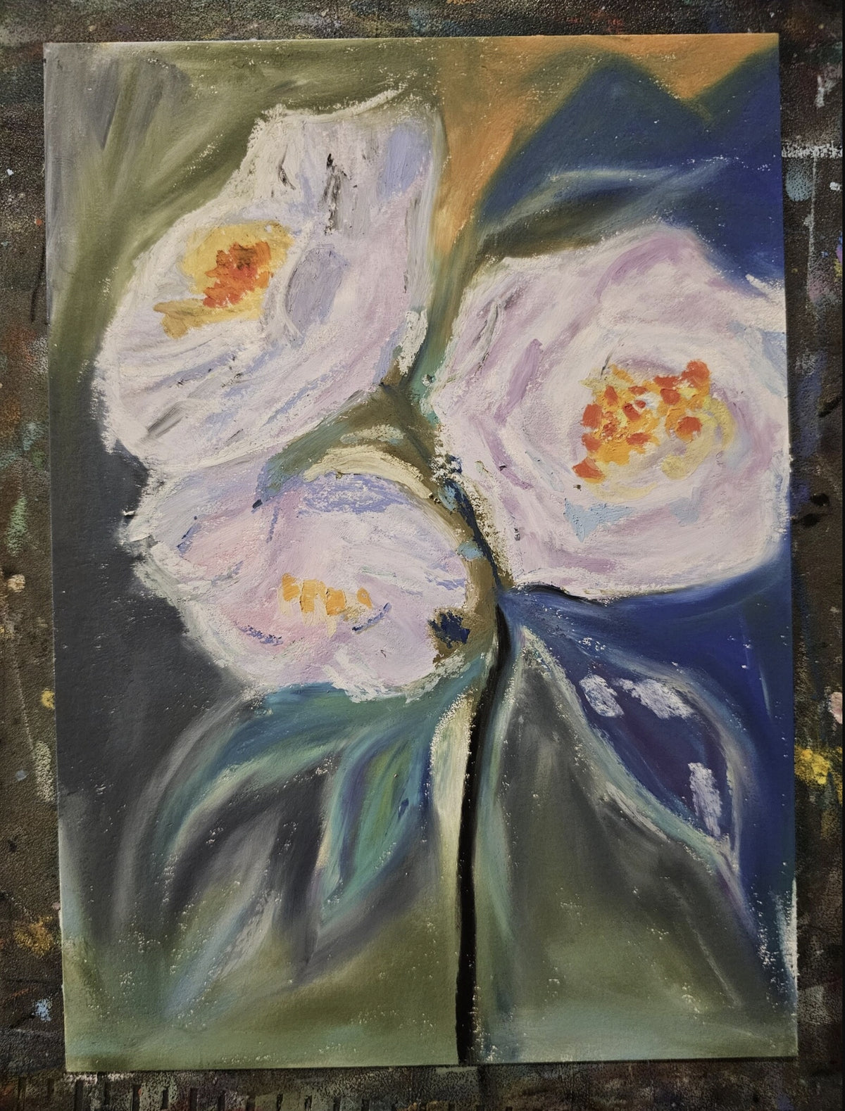 A view of the original 5x7 Healing Roses painting on the artist's studio table, showing the authentic oil pastel medium and the creation process by Bloodmoon.