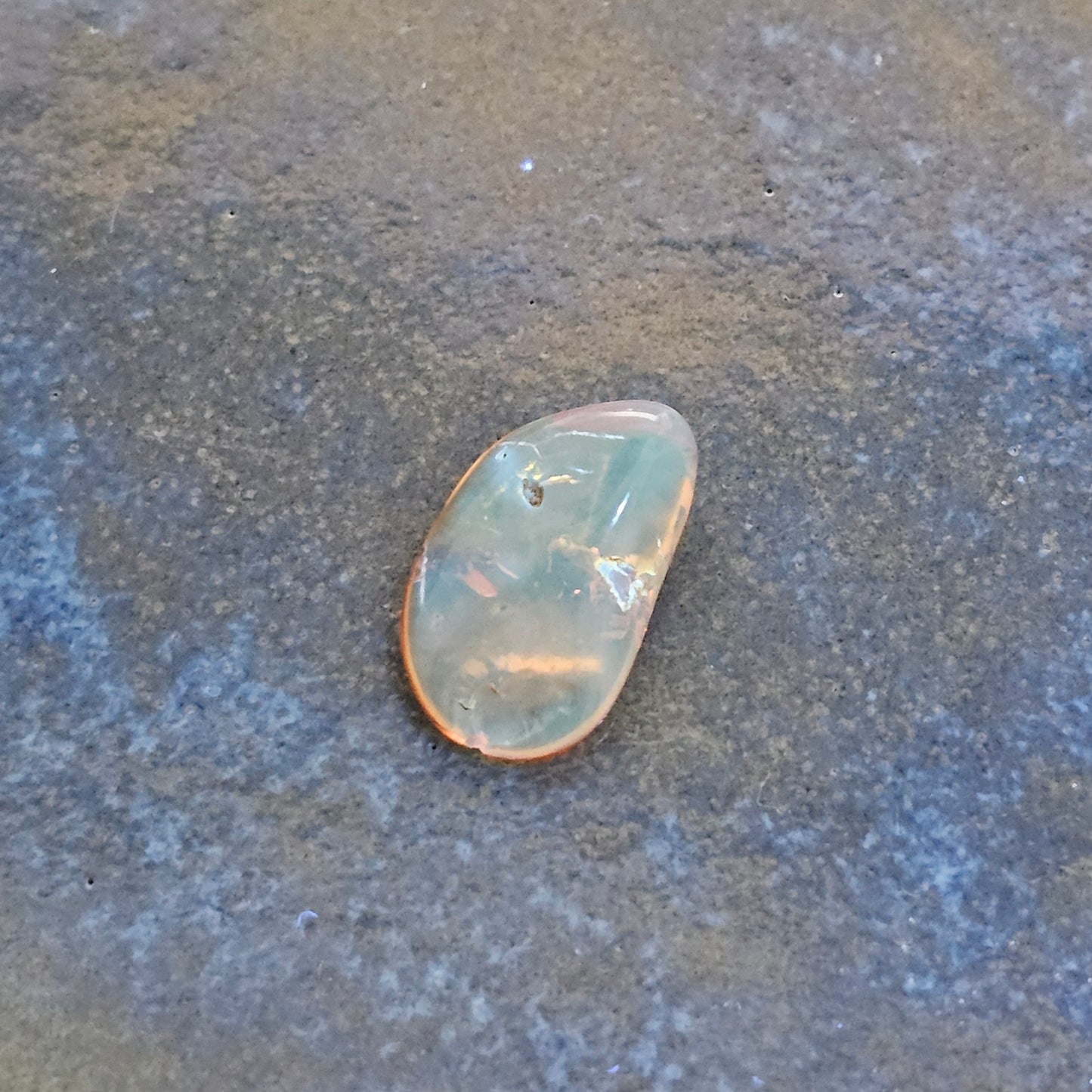Genuine Baltic amber fluorescing soft blue under UV light, an authenticity test for natural succinite