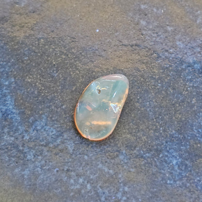Genuine Baltic amber fluorescing soft blue under UV light, an authenticity test for natural succinite