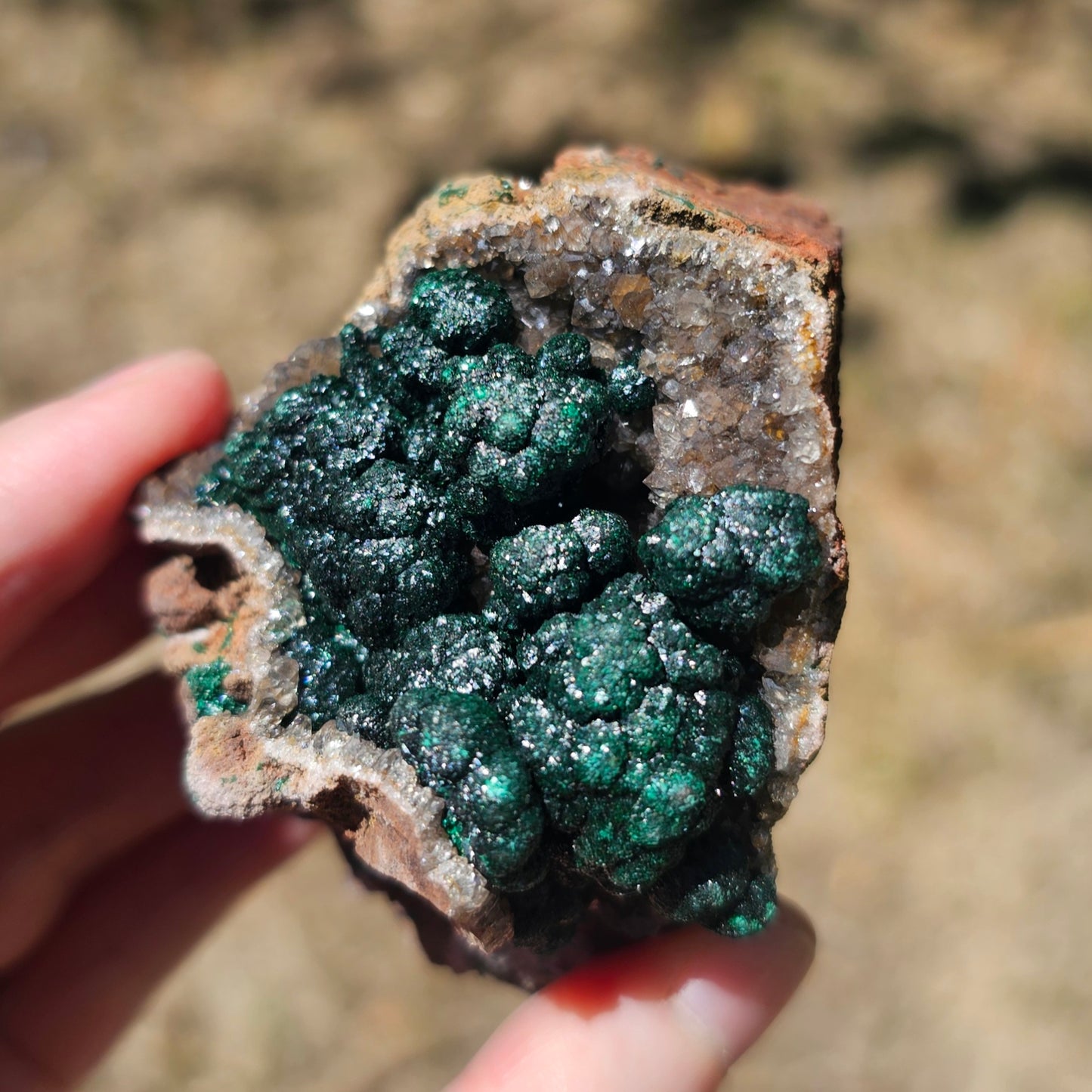 A-grade forest green Malachite balls clustered on a natural quartz-feldspar matrix from Mindigi Mine, Congo.