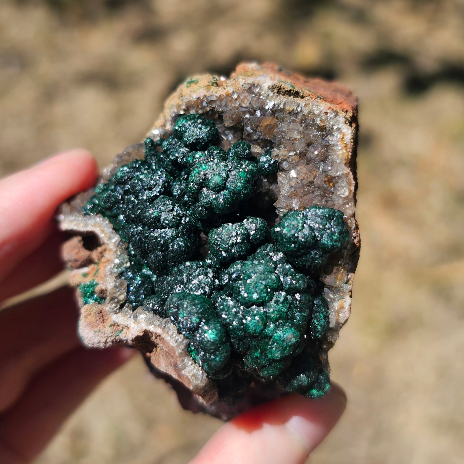 A-grade forest green Malachite balls clustered on a natural quartz-feldspar matrix from Mindigi Mine, Congo.
