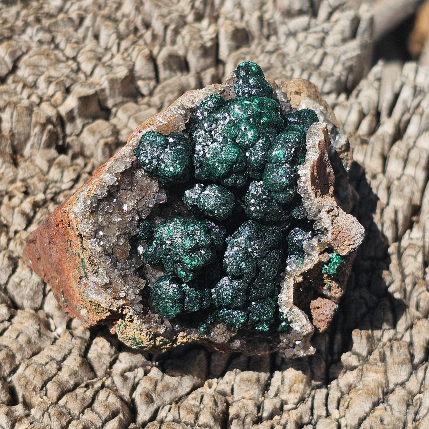 A-grade forest green Malachite balls clustered on a natural quartz-feldspar matrix from Mindigi Mine, Congo.