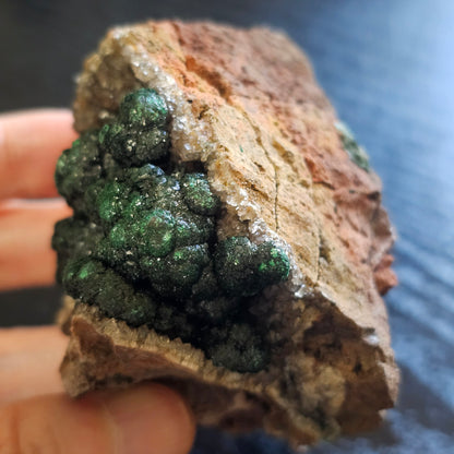 A-grade forest green Malachite balls clustered on a natural quartz-feldspar matrix from Mindigi Mine, Congo.