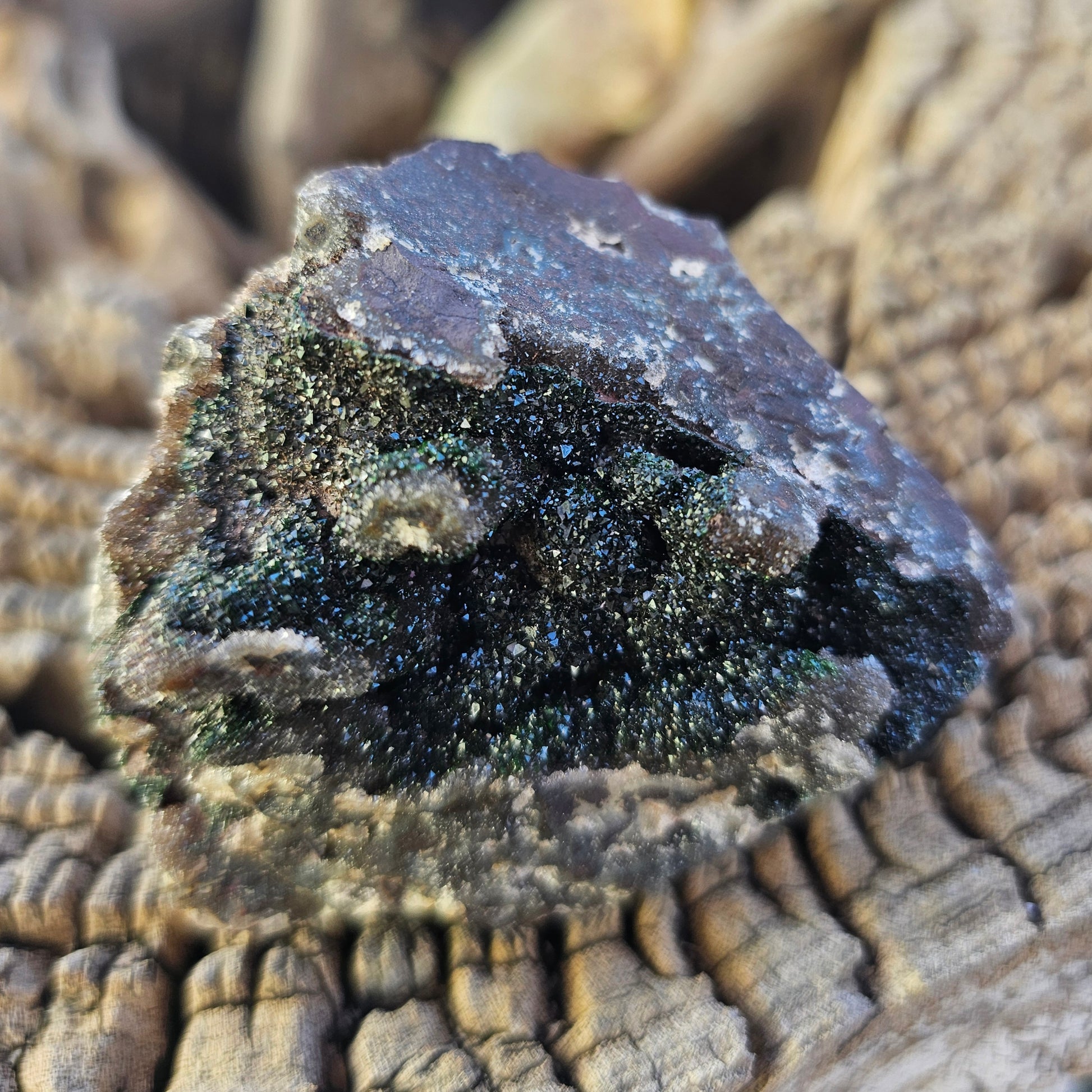 Raw mineral specimen from Congo featuring a cluster of green Duftite and dark metallic Hematite with a dusting of sparkling Druzy Quartz on a Dolomite matrix.