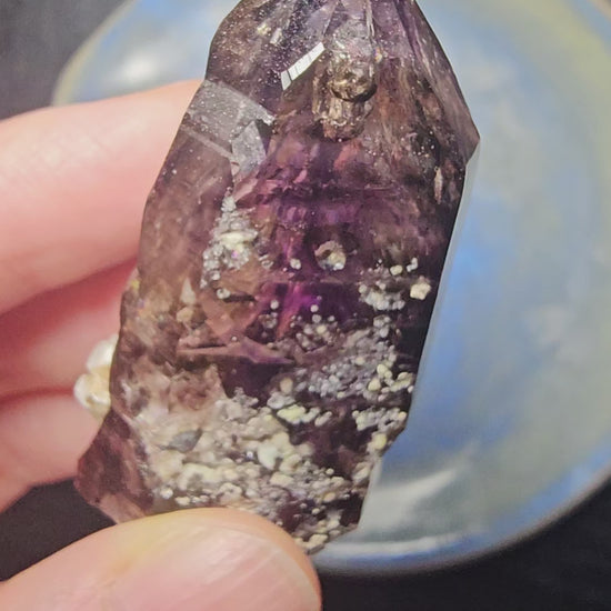 Brandberg Amethyst Enhydro from Namibia — two moving water bubbles visible inside 34g violet flame crystal