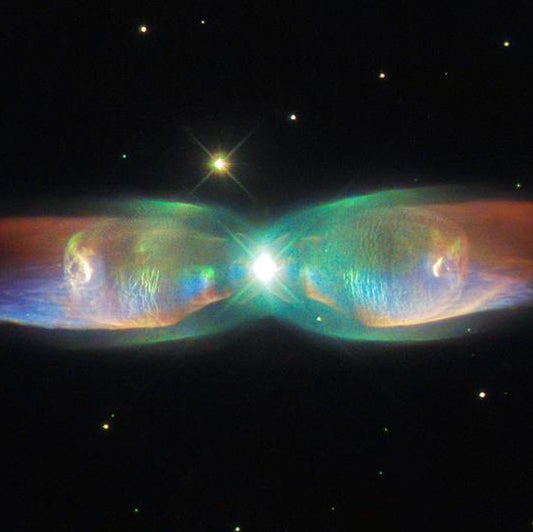 Twin Jet Nebula (PN M2-9) — a bipolar planetary nebula formed by a binary star system. Image: ESA/Hubble & NASA.